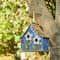 Glitzhome® 10.5" Distressed Wood Birdhouse with Flowers